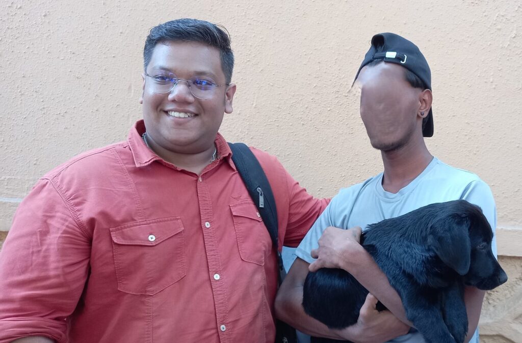 Sagar and a child with puppy